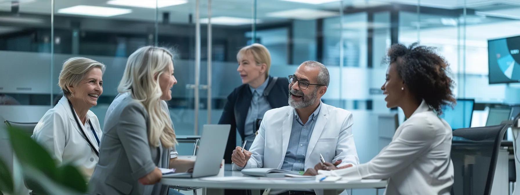 a sleek, modern office environment showcases a diverse group of professionals engaged in a focused discussion around a sophisticated digital dashboard, illustrating the streamlined and efficient benefits of physician credentialing services.